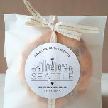 Seattle Deco Skyline | Wedding Welcome Favor Classic Round Sticker<br><div class="desc">Enhance your wedding welcome packages or event party favors with a custom set of welcome stickers! These elegant yet minimal-style stickers are tailored for a wedding taking place in the beautiful city of Seattle, Washington. They feature a modern deco skyline with the name of the city integrated underneath. All elements...</div>