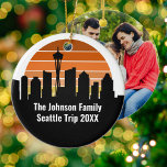Seattle Skyline Sunset Trip Photo Custom Christmas Ceramic Ornament<br><div class="desc">Cool customized Seattle trip souvenir keepsake Christmas ornament gift featuring the city skyline at sunset and your family vacation photo on the back. A silhouette of the city buildings in Washington,  including the space needle above your personalized text.</div>