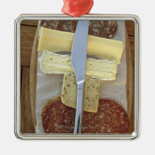 Selection of gourmet cheeses and cut meats metal ornament