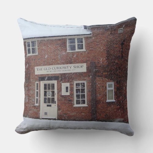 sepia photo of the old curiosity shop in snow throw pillow