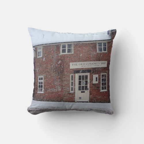 sepia photo of the old curiosity shop in snow throw pillow