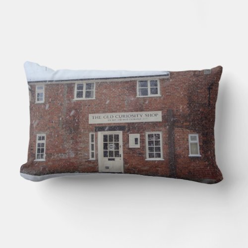 sepia photo of the old curiosity shop in snowscene lumbar pillow