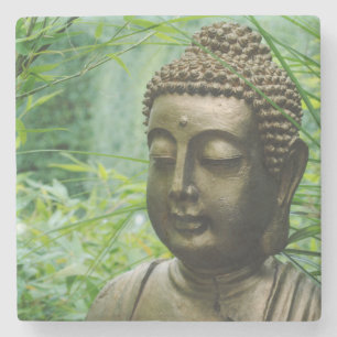 Serene Buddha Statue in a Leafy Green Forest Stone Coaster