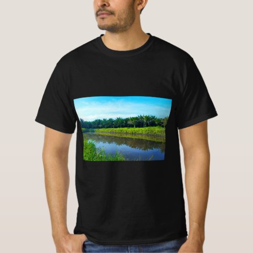 Serene River Landscape with Lush Vegetation A Tra T_Shirt