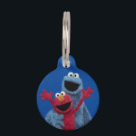 Sesame Street | Elmo & Cookie Monster Pet ID Tag<br><div class="desc">Celebrate friendship with this cheerful and colorful tag! It features a heartwarming image of Elmo and Cookie Monster hugging, capturing the spirit of Sesame Street best friends. Perfect for easily identifying keys, brightening up a backpack, or serving as a fun tag for a pet's collar, this accessory is a vibrant...</div>