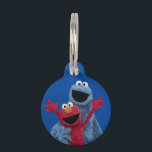Sesame Street | Elmo & Cookie Monster Pet ID Tag<br><div class="desc">Celebrate friendship with this cheerful and colorful tag! It features a heartwarming image of Elmo and Cookie Monster hugging, capturing the spirit of Sesame Street best friends. Perfect for easily identifying keys, brightening up a backpack, or serving as a fun tag for a pet's collar, this accessory is a vibrant...</div>