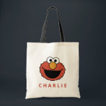 Sesame Street | Elmo Tote Bag<br><div class="desc">Carry your essentials with a smile from the happiest monster on Sesame Street! This adorable and fun Elmo face tote bag features Elmo's iconic, cheerful red face printed on a natural canvas-colored bag. It is fully customizable: simply add any name below the design, which will be printed in a coordinating...</div>