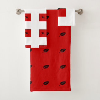 Set of red and white bath towels with leaves