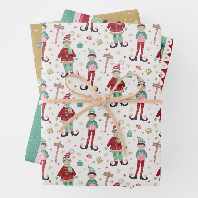 Set of Three Colorful Christmas Elf Wrapping Paper Sheets (In situ)
