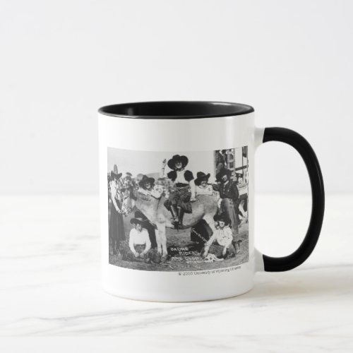 Seven rodeo cowgirls jokingly posing with a donkey mug