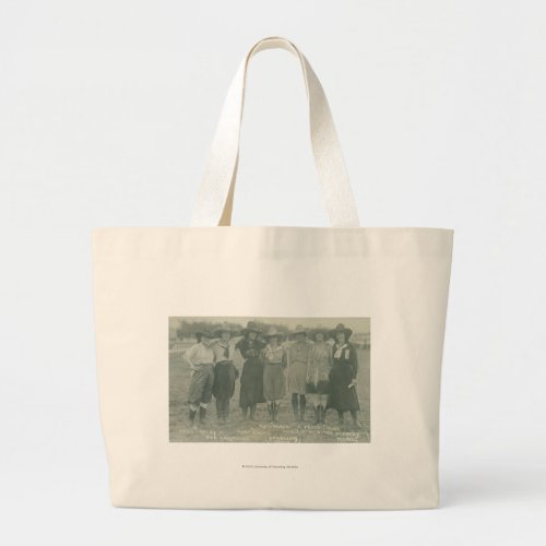 Seven rodeo cowgirls posing for a photograph large tote bag