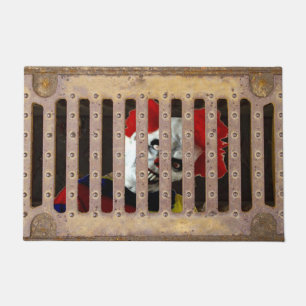 sewer grate w/ scary clown doormat