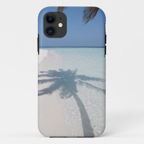 Shadow of a palm tree on a deserted island beach iPhone 11 case