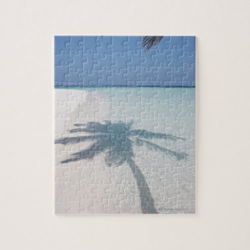 Shadow of a palm tree on a deserted island beach jigsaw puzzle