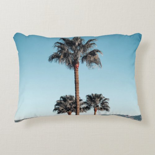 Shallow focus photo of palm trees in the morning accent pillow