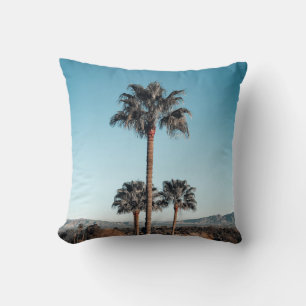 Shallow focus photo of palm trees in the morning throw pillow