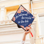 She Believed She Could | Custom Class Year Graduation Cap Topper<br><div class="desc">Cute grad cap topper features the quote "she believed she could,  so she did" in white calligraphy lettering on a royal blue background adorned with blush pink and peach flowers. Personalize with your class year.</div>