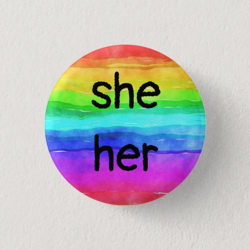 sheher pronouns on a rainbow button