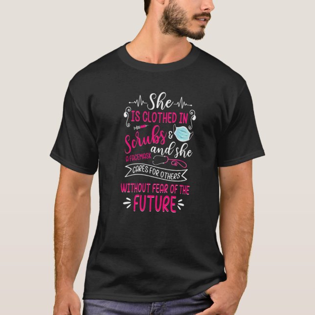 She Is Clothed In Scrubs & Facemask Proud Nurse Nu T-Shirt (Front)