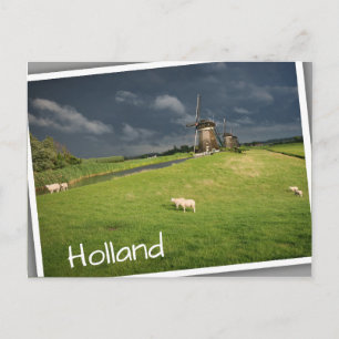 Sheep with windmills under dark clouds postcard