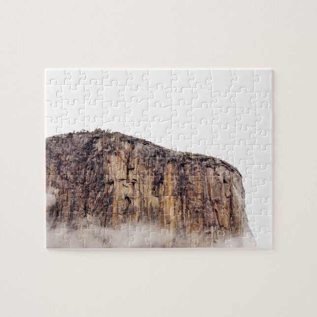 Sheer cliff rising above clouds jigsaw puzzle (Horizontal)