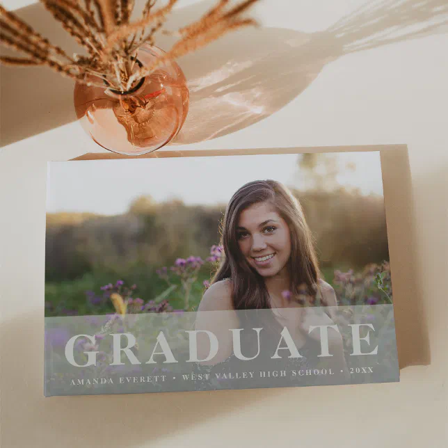 Simple customized graduation guestbook with a picture of the graduate.