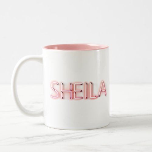 Sheila name in glowing neon lights novelty Two_Tone coffee mug