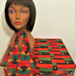 Shell African Color Designer Crochet Print Chiffon Scarf<br><div class="desc">Red black and green striped image with white African cowrie shell printed on chiffon scarf is from a photo of an original crocheted creation designed handmade and Copyright © by published designer Delores Chamblin. The picture of the rectangular handcrafted clutch bag is repeated on the sheer fabric of the neckwear...</div>