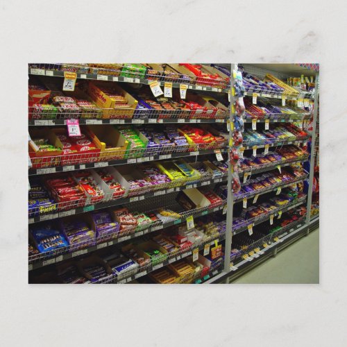 Shelves of chocolate bars in store postcard
