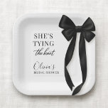 She's Tying The Knot Black Bow Party Paper Plates<br><div class="desc">Party paper plates designed with a classic black bow motif and the phrase shes tying the knot. Created for a clean, elegant table setting that pairs well with black and white wedding decor. Suitable for bridal showers, engagement parties, bachelorette gatherings, and wedding celebrations. Fully customizable text with a print-ready design...</div>