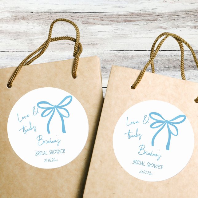 She's tying the knot blue ribbon bow favor classic round sticker (She's tying the knot blue ribbon bow bridal shower thank you favor classic round sticker)