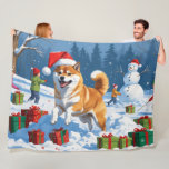 Shiba Inu Running in Snow with Christmas Hat Fleece Blanket<br><div class="desc">A spirited Shiba Inu runs joyfully through the snowy winter scene,  wearing a festive red Christmas hat. This charming design highlights the breed’s foxlike face,  curled tail,  and confident personality while capturing the warmth and joy of the holiday season. A delightful winter moment full of festive cheer.</div>