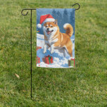 Shiba Inu Running in Snow with Christmas Hat Garden Flag<br><div class="desc">A spirited Shiba Inu runs joyfully through the snowy winter scene,  wearing a festive red Christmas hat. This charming design highlights the breed’s foxlike face,  curled tail,  and confident personality while capturing the warmth and joy of the holiday season. A delightful winter moment full of festive cheer.</div>
