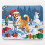 Shiba Inu Running in Snow with Christmas Hat Mouse Pad<br><div class="desc">A spirited Shiba Inu runs joyfully through the snowy winter scene,  wearing a festive red Christmas hat. This charming design highlights the breed’s foxlike face,  curled tail,  and confident personality while capturing the warmth and joy of the holiday season. A delightful winter moment full of festive cheer.</div>