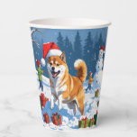 Shiba Inu Running in Snow with Christmas Hat Paper Cups<br><div class="desc">A spirited Shiba Inu runs joyfully through the snowy winter scene,  wearing a festive red Christmas hat. This charming design highlights the breed’s foxlike face,  curled tail,  and confident personality while capturing the warmth and joy of the holiday season. A delightful winter moment full of festive cheer.</div>