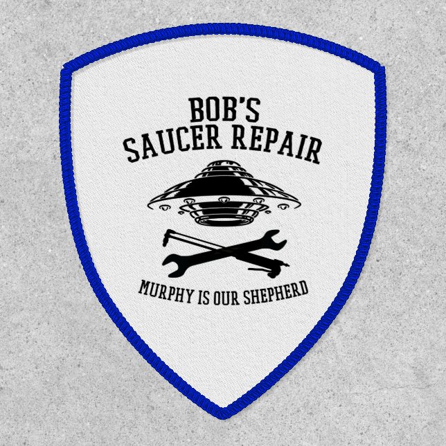 Shield patch with Bob's Saucer Repair logo (Front)