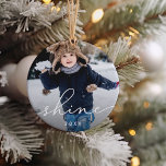 Shine Script | Photo Ceramic Ornament<br><div class="desc">Simple and elegant holiday ornament features a photo on each side with "shine" overlaid in white script lettering. Personalized with the year beneath.</div>