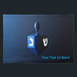 Shiny Blue Dreidel Cloth Placemat<br><div class="desc">A modernistic,  metallic blue dreidel against a dark,  night-like background.  Two of the Hebrew letters found on a dreidel,  nun and shin,  glow brightly.  Add your own text.</div>