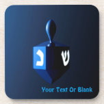 Shiny Blue Dreidel Drink Coaster<br><div class="desc">A modernistic,  metallic blue dreidel against a dark,  night-like background.  Two of the Hebrew letters found on a dreidel,  nun and shin,  glow brightly.  Add your own text.</div>