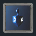 Shiny Blue Dreidel Gunmetal Finish Lapel Pin<br><div class="desc">A modernistic,  metallic blue dreidel against a dark,  night-like background.  Two of the Hebrew letters found on a dreidel,  nun and shin,  glow brightly.</div>