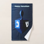 Shiny Blue Dreidel Hand Towel<br><div class="desc">A modernistic,  metallic,  blue dreidel against a dark,  night-like background.  Two of the Hebrew letters found on a dreidel,  nun and shin,  glow brightly.  Text reading "Happy Hanukkah" also appears in glowing blue and white.</div>