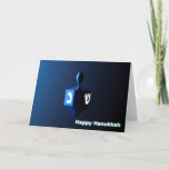 Shiny Blue Dreidel Holiday Card<br><div class="desc">A modernistic,  metallic,  blue dreidel against a dark,  night-like background.  Two of the Hebrew letters found on a dreidel,  nun and shin,  glow brightly.  Text reading "Happy Hanukkah" also appears in glowing blue and white.</div>