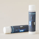 Shiny Blue Dreidel Lip Balm<br><div class="desc">A modernistic, metallic, blue dreidel against a dark, night-like background. Two of the Hebrew letters found on a dreidel, nun and shin, glow brightly. Hebrew text reading "Chag Chanukkah Sameach" (Happy Hanukkah) also appears in glowing blue and white.</div>