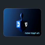 Shiny Blue Dreidel Magnet<br><div class="desc">A modernistic,  metallic blue dreidel against a dark,  night-like background.  Two of the Hebrew letters found on a dreidel,  nun and shin,  glow brightly.  Hebrew text reading "Chag Chanukkah Sameach" (Happy Hanukkah) also appears in glowing blue and white.</div>