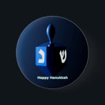 Shiny Blue Dreidel Pinback Button<br><div class="desc">A modernistic,  metallic blue dreidel against a dark,  night-like background.  Two of the Hebrew letters found on a dreidel,  nun and shin,  glow brightly.  Text reading "Happy Hanukkah" also appears in glowing blue and white.</div>