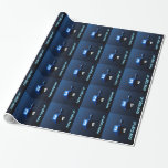 Shiny Blue Dreidel Wrapping Paper<br><div class="desc">A modernistic,  metallic blue dreidel against a dark,  night-like background.  Two of the Hebrew letters found on a dreidel,  nun and shin,  glow brightly.  Hebrew text reading "Chag Chanukkah Sameach" (Happy Hanukkah) also appears in glowing blue and white.</div>