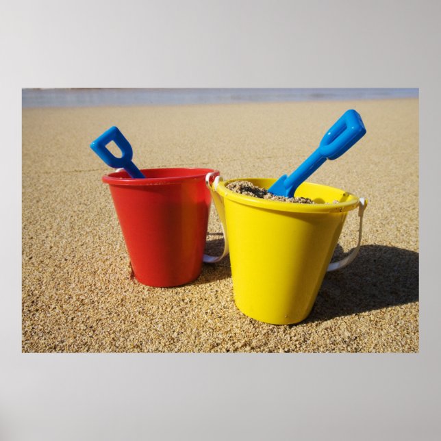 Shovels And Pails On Sandy Beach Poster (Front)