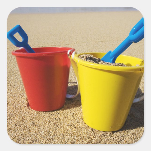 Shovels And Pails On Sandy Beach Square Sticker (Front)