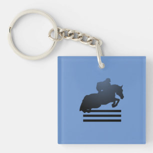 Show jumper clearing an obstacle. Keychain