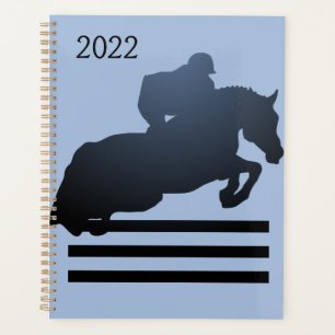 Show jumper clearing an obstacle. planner